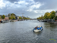 Canal with Bridges and Tour Boat in the Rain